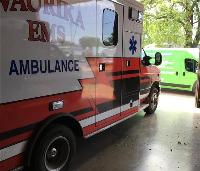 Ambulance and green van