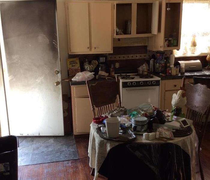 kitchen with burned doors, blackened contents