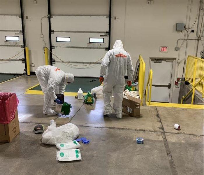 warehouse men in white PPE