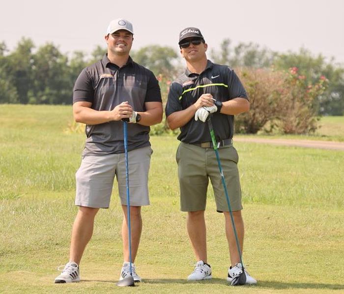 two men golfing