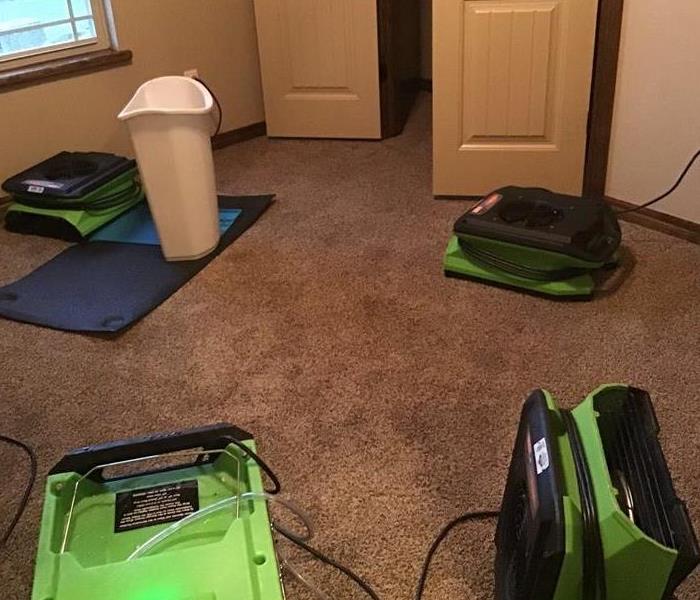 bedroom, wet carpet, green fans