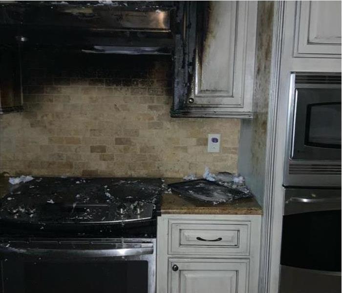 burned kitchen stove, cabinets