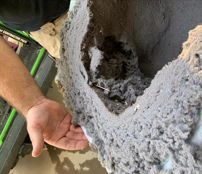 HEPA filter full of dirt and debris after a duct cleaning.
