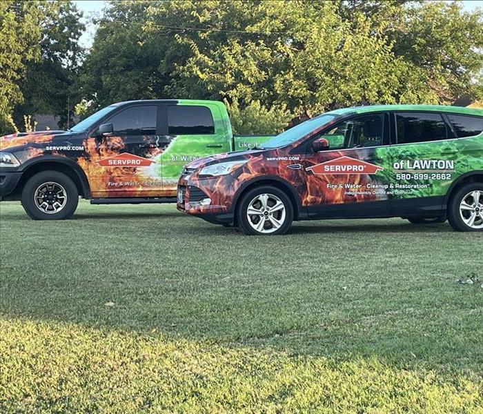 car and truck with red flames and green paint