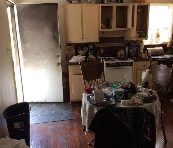 burned kitchen door, soot damage