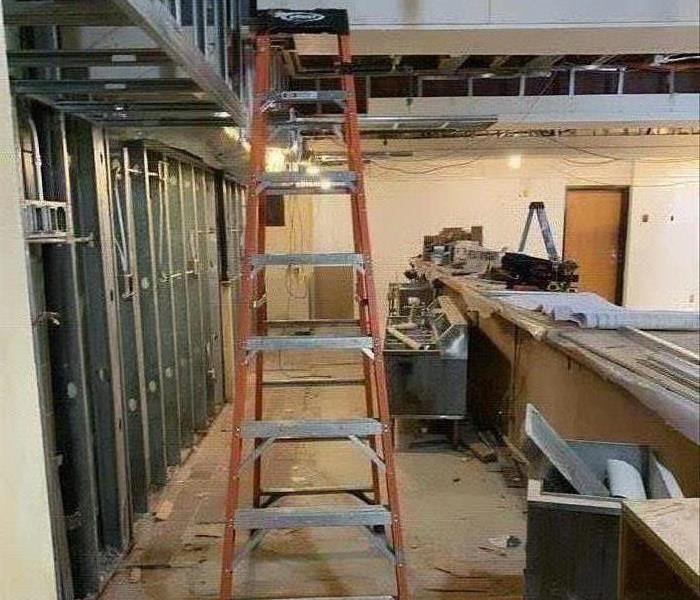 bare floors, studs, ladder
