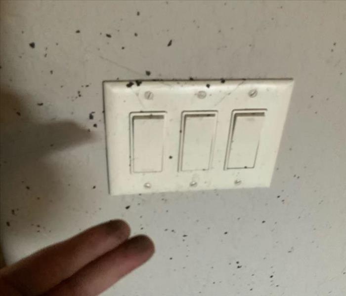 soot stained wall and light switches